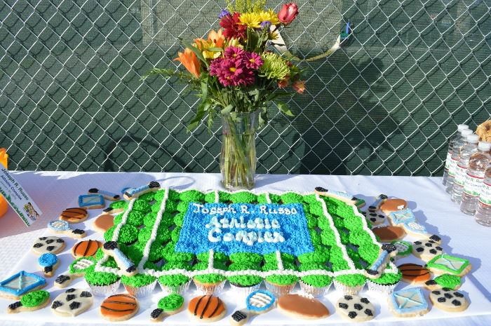 Sport themed decorated cookies and cupcakes.